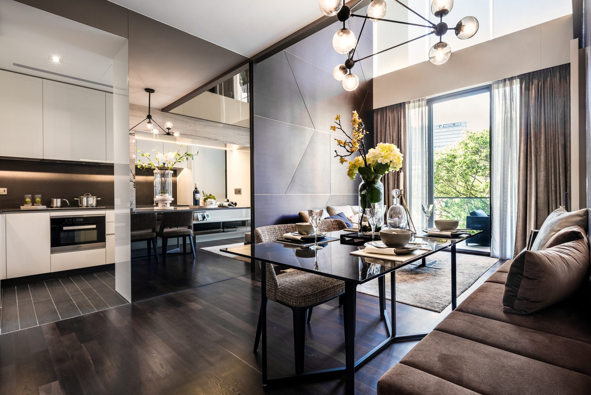 Kitchen and dining area with a sculptural pendant light cluster
